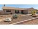 Single-story home featuring desert landscaping with natural rocks and desert plants at 3529 W Saint Moritz Ln, Phoenix, AZ 85053