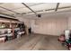 Spacious garage with shelves, cabinets and concrete floor at 3529 W Saint Moritz Ln, Phoenix, AZ 85053