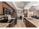 Bright and spacious kitchen with granite countertops, stainless steel appliances and an open layout at 3529 W Saint Moritz Ln, Phoenix, AZ 85053