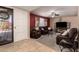 Inviting living room with an accent wall, comfortable seating and a view of the front yard at 3529 W Saint Moritz Ln, Phoenix, AZ 85053