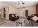 Cozy living room featuring comfortable seating, a glass table, and seamless entryway access at 3529 W Saint Moritz Ln, Phoenix, AZ 85053