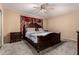 Well-lit main bedroom with a large bed, side tables, and carpeted flooring at 3529 W Saint Moritz Ln, Phoenix, AZ 85053