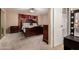Spacious main bedroom featuring a large bed, carpeted floors, and an adjacent makeup area at 3529 W Saint Moritz Ln, Phoenix, AZ 85053