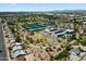 Aerial view showcases community amenities like tennis courts and sports facilities, promoting an active lifestyle at 414 E Westchester Dr, Tempe, AZ 85283