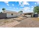 Backyard with storage shed, brick-lined feature and covered area with an outdoor grill at 414 E Westchester Dr, Tempe, AZ 85283