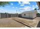 View of a large backyard area featuring a detached storage shed and potential for customization and landscaping at 414 E Westchester Dr, Tempe, AZ 85283