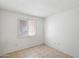 A bright bedroom offering a neutral color palette, tile flooring and a window for natural light at 414 E Westchester Dr, Tempe, AZ 85283