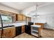 Well-lit kitchen featuring a breakfast bar and access to the dining area at 414 E Westchester Dr, Tempe, AZ 85283