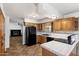 Functional kitchen featuring tile countertops and modern appliances at 414 E Westchester Dr, Tempe, AZ 85283