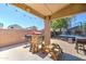 A covered back patio with playground and barbecue, along with a backyard trampoline at 4199 E Citrine Rd, San Tan Valley, AZ 85143