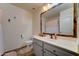 A bathroom featuring a vanity with drawers and a decorative framed mirror at 4199 E Citrine Rd, San Tan Valley, AZ 85143