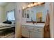 Stylish bathroom featuring a white vanity, mosaic tile backsplash, and modern lighting fixtures at 4199 E Citrine Rd, San Tan Valley, AZ 85143