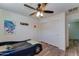 A cozy bedroom with a themed car bed, ceiling fan, and closet space at 4199 E Citrine Rd, San Tan Valley, AZ 85143
