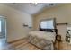 Bright bedroom featuring a neutral color scheme, vaulted ceilings, and modern wood floors at 4199 E Citrine Rd, San Tan Valley, AZ 85143