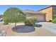 Attractive single-story home features a low-maintenance desert landscape and a two-car garage at 4199 E Citrine Rd, San Tan Valley, AZ 85143