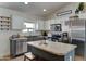 Modern kitchen with stainless steel appliances, island and gray cabinetry at 4199 E Citrine Rd, San Tan Valley, AZ 85143