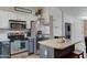 Modern kitchen with stainless steel appliances, island and two-tone cabinetry at 4199 E Citrine Rd, San Tan Valley, AZ 85143