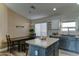 Stylish kitchen with island, modern appliances, ample counter space and dining area at 4199 E Citrine Rd, San Tan Valley, AZ 85143