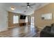 Spacious living room featuring sleek flooring, neutral paint, lots of natural light, and a ceiling fan at 4199 E Citrine Rd, San Tan Valley, AZ 85143