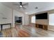 Spacious living room featuring a television and wood entertainment center with views to separate office space at 4199 E Citrine Rd, San Tan Valley, AZ 85143