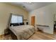 A bright main bedroom featuring a queen bed, open closet, and access to the main bath at 4199 E Citrine Rd, San Tan Valley, AZ 85143