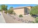 The home features a low-maintenance rock and boulder landscape at 4199 E Citrine Rd, San Tan Valley, AZ 85143