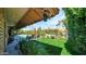 Lush backyard with a covered patio, sparkling pool, and manicured lawn, ideal for outdoor entertaining at 426 E Carol Ann Way, Phoenix, AZ 85022