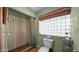 Bathroom featuring a window, shower, and toilet at 426 E Carol Ann Way, Phoenix, AZ 85022