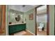 Spacious bathroom with a vanity and a view of the attached toilet and shower at 426 E Carol Ann Way, Phoenix, AZ 85022