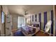 Charming bedroom with personalized decor, a comfortable bed, and ample natural light at 426 E Carol Ann Way, Phoenix, AZ 85022