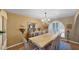 Elegant dining room featuring a large table, chandelier, and classic decor at 426 E Carol Ann Way, Phoenix, AZ 85022