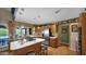 Spacious kitchen featuring an island with bar seating, ample counter space, and modern appliances at 426 E Carol Ann Way, Phoenix, AZ 85022