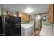 Laundry room with white washer and dryer and access to the bathroom and shower at 426 E Carol Ann Way, Phoenix, AZ 85022