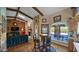 Inviting living room featuring exposed beams, fireplace, and a view of the patio at 426 E Carol Ann Way, Phoenix, AZ 85022