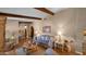 Spacious living area with hardwood floors, exposed beams, and comfortable seating at 426 E Carol Ann Way, Phoenix, AZ 85022