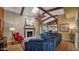 Open-concept living room with fireplace, comfortable seating, and ample natural light at 426 E Carol Ann Way, Phoenix, AZ 85022