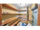 Well-organized pantry with wooden shelves and storage containers for efficient kitchen storage at 426 E Carol Ann Way, Phoenix, AZ 85022