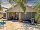 Spacious backyard with a covered patio, pool, and outdoor furniture at 45726 W Long Way, Maricopa, AZ 85139