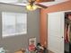 Comfortable secondary bedroom with neutral walls, large window, and ceiling fan at 45726 W Long Way, Maricopa, AZ 85139