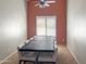 Formal dining room with a large table, chairs, and a window at 45726 W Long Way, Maricopa, AZ 85139