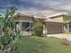Charming single-story home with well-maintained lawn, desert landscaping, and an attached two-car garage at 45726 W Long Way, Maricopa, AZ 85139