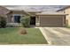 Beautiful single-story home with lush green lawn, desert landscaping, and a convenient two-car garage at 45726 W Long Way, Maricopa, AZ 85139