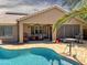 Inviting backyard pool with brick patio and covered outdoor seating area at 45726 W Long Way, Maricopa, AZ 85139