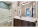 Bathroom with white vanity, shower/tub combo, and oil rubbed bronze fixtures at 4712 E Bonanza Rd, Gilbert, AZ 85297