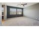 Large bedroom featuring neutral carpet, a ceiling fan, and ample natural light at 4712 E Bonanza Rd, Gilbert, AZ 85297