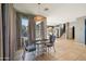 Cozy dining area with modern lighting and easy access to the kitchen at 4712 E Bonanza Rd, Gilbert, AZ 85297