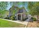 Charming two-story home with mature shade trees and desert landscaping for curb appeal at 4712 E Bonanza Rd, Gilbert, AZ 85297