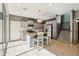 Bright kitchen with stainless steel appliances, kitchen island and staircase access at 4712 E Bonanza Rd, Gilbert, AZ 85297