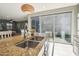 Bright kitchen featuring granite countertops, stainless steel sink, and sliding doors to the backyard at 4712 E Bonanza Rd, Gilbert, AZ 85297