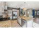 Bright kitchen featuring stainless steel appliances, granite countertops, and tile backsplash at 4712 E Bonanza Rd, Gilbert, AZ 85297